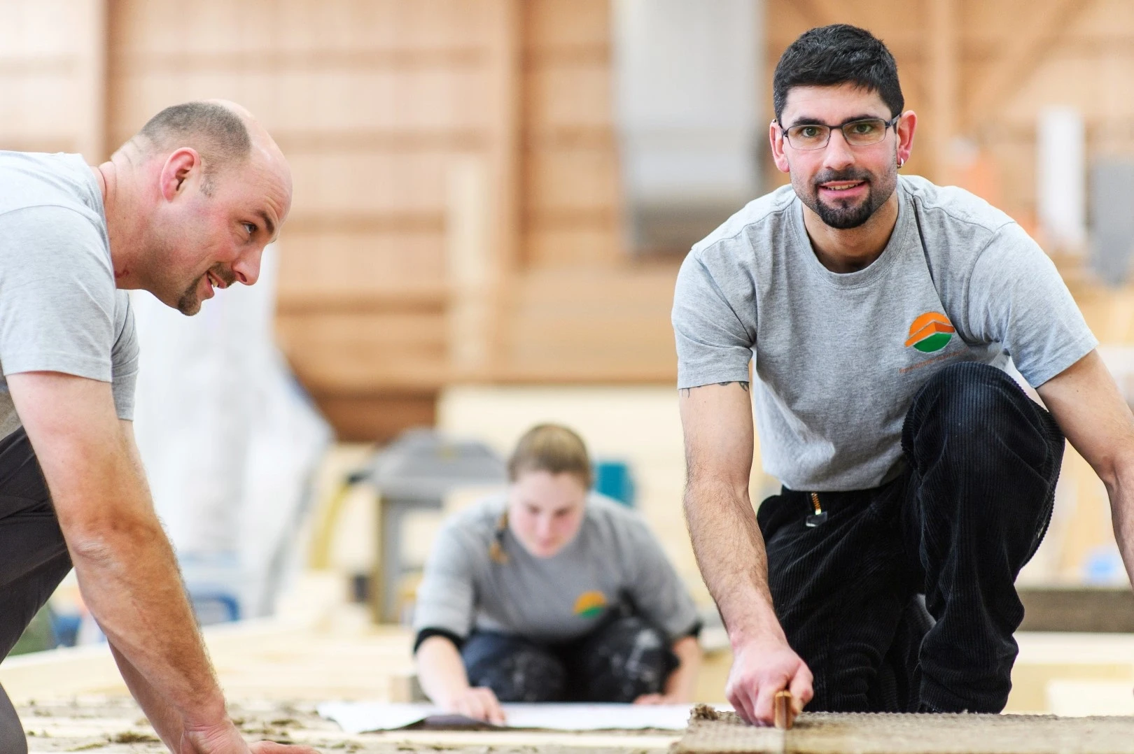 employees manufacturing timber house elements