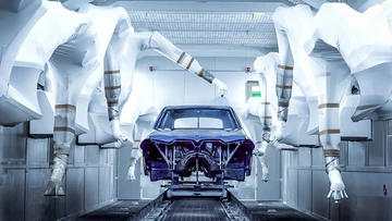 painting robots painting a car