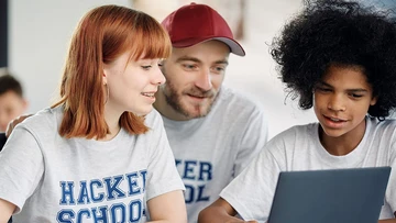 Youth learning programming at a computer