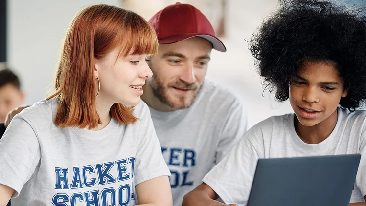 Youth learning programming at a computer