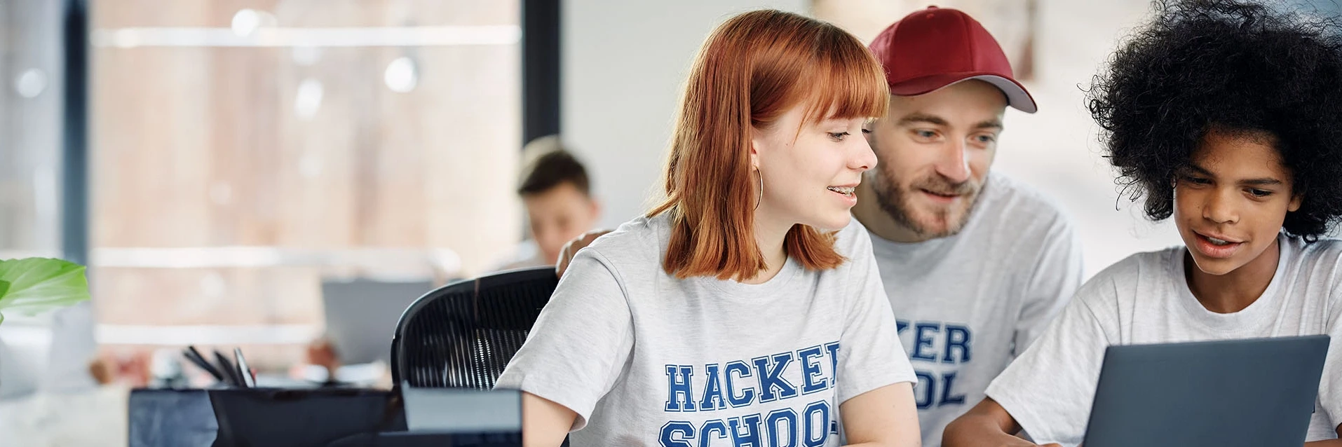 Youth learning programming at a computer